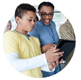 Teacher and student looking at a tablet together