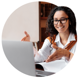 Woman gesturing to laptop