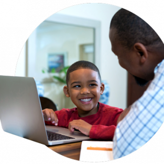 K-12 student and his father using PowerSchool Student Enrollment Management Software at home
